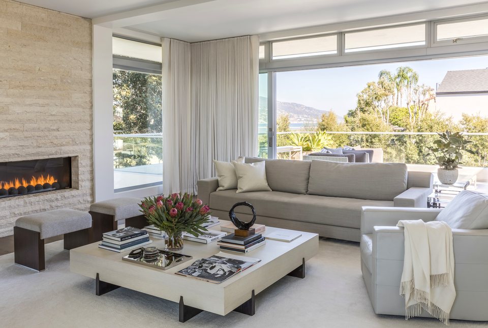 Malibu living room with glass and fireplace