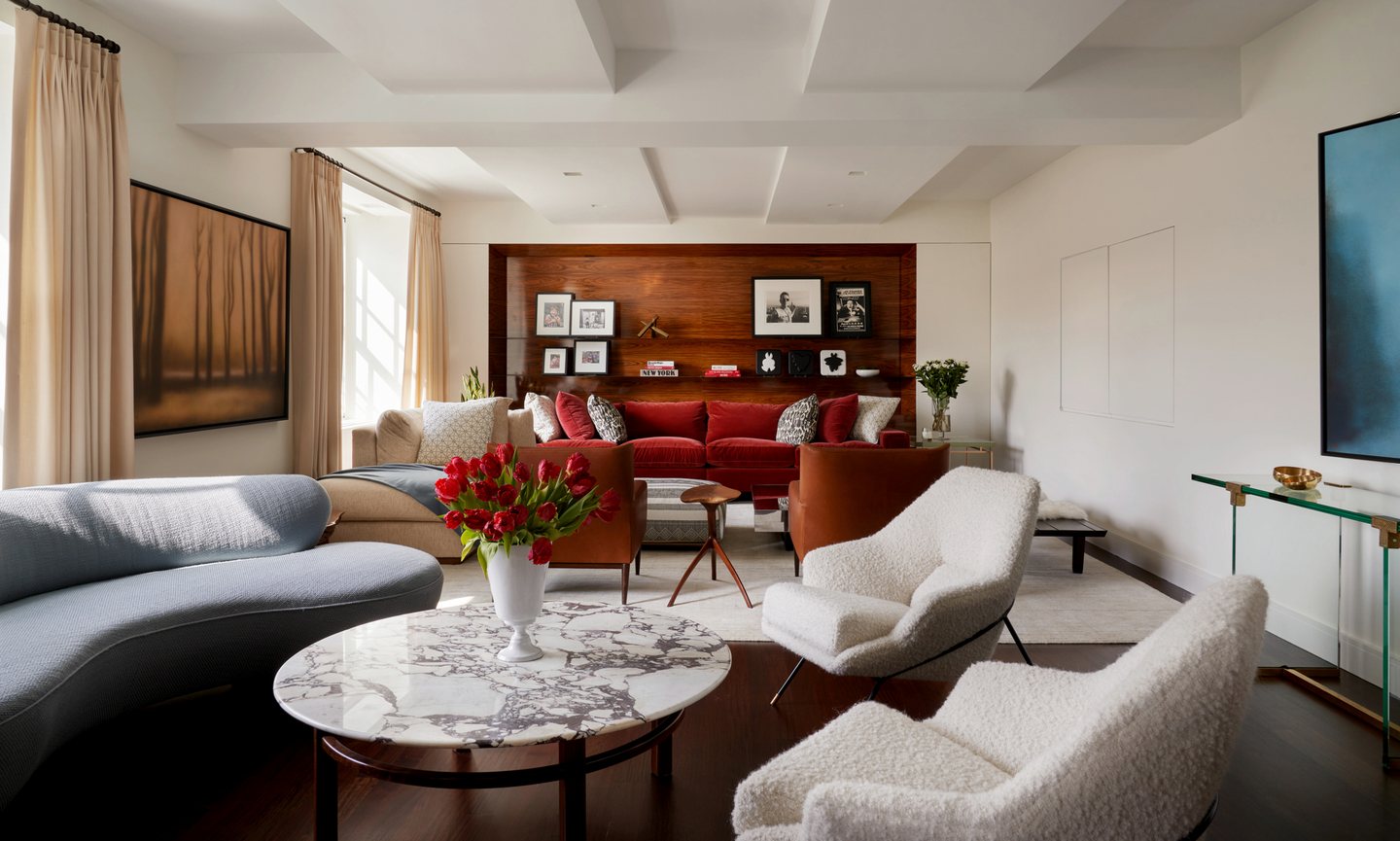 Urban residence living room with crimson seating